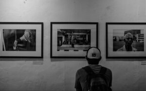 Interior wall of Konditorei Café in Portola Valley displaying a black-and-white photography exhibit featuring street scenes.