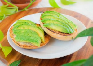 Avocado Bagel with sliced avocado, salt & pepper, on a toasted bagel at Konditorei Cafe. 